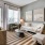 spacious living area with ample room for movement and natural lighting from large windows
